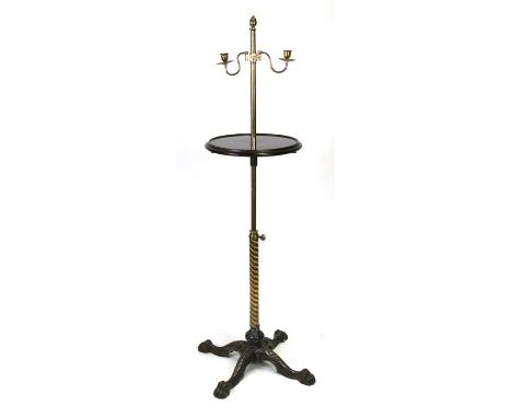 A Victorian cast iron brass and mahogany adjustable reader's standard lamp, with quatreform base, a pair of sconces and a mah