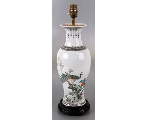 A Chinese Republic style vase form table lamp decorated with a peacock and calligraphy, 35cms (13.75ins) high.