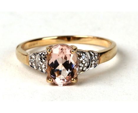 A 9ct gold morganite and diamond ring. Approx UK size N  1.8g