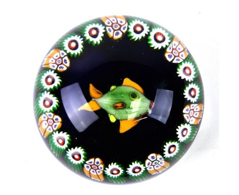 A Ysart fish paperweight, the central fish surrounded by cane garlands, on a midnight blue ground with concave underside, pro