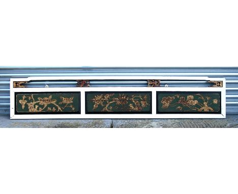 A Chinese carved wood and painted hanging wall panel, 208cms (82ins) wide.