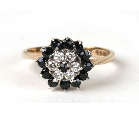 A 9ct gold sapphire cluster ring. Approx. Uk size N. 2.6g