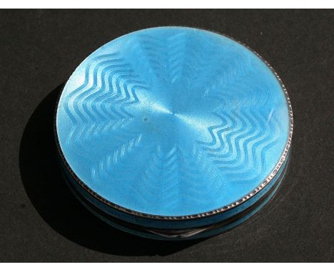 A blue guilloche enamel powder compact with London import marks, 6cms (2.25ins) diameter.Condition Reportchips to the enamel 