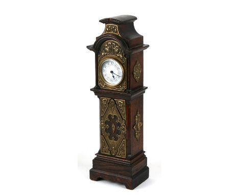 A 19th century style oak miniature longcase clock, the hood and trunk with applied brass decoration, 39cms (15.25ins) high.