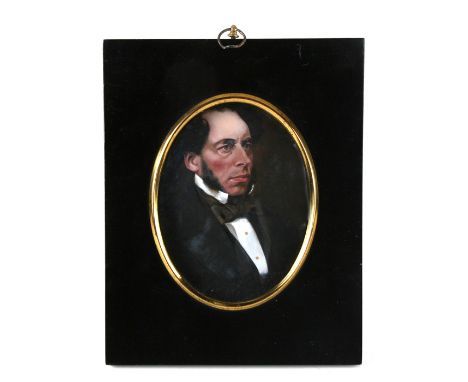 A 19th century oval portrait miniature depicting a gentleman wearing evening dress, oil on board, framed, 10 by 15cms (4 by 5