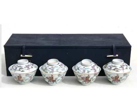 A set of four Chinese famille rose cups and covers, decorated with a figure on horseback with his attendants, red seal mark t