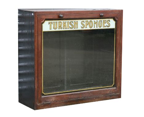 A late Victorian / Edwardian mahogany shopkeeper's display cabinet with a single glazed panel front decorated with gilt lette