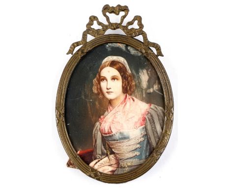 A portrait miniature depicting a young lady wearing a bonnet, in an ornate metal frame, 7 by 8cms (2.75 by 3.1ins).Condition 