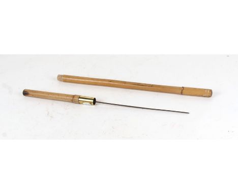 A cane military swagger stick with concealed square section Stiletto Dagger . Overall length 60.5cms (23.75ins) with a blade 