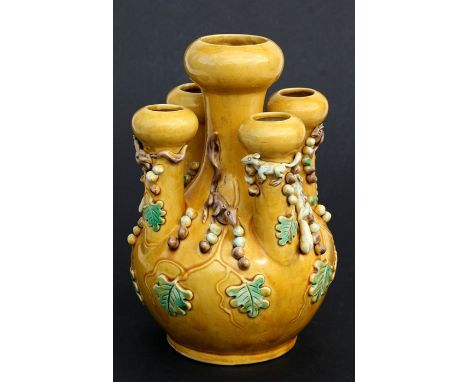 A Chinese yellow glaze crocus vase with applied squirrels and oak leaves, impressed seal mark to the underside, 21cms (8.25in