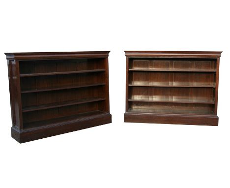 A pair of figured walnut open bookcases with three adjustable shelves, on plinth bases, 160cms (63ins) wide.Condition ReportS