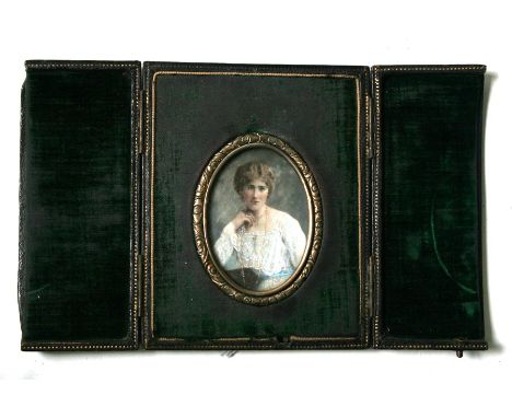 A late 19th century portrait miniature depicting a young girl, in original leather case, 7cms (2.75ins) high.Condition Report