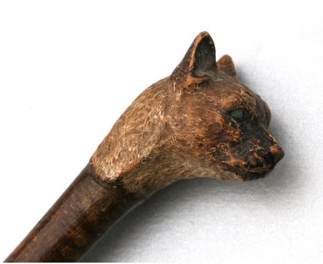 A folk art walking stick, the handle in the form of a Siamese cat head, 103cms (40.5ins) long.