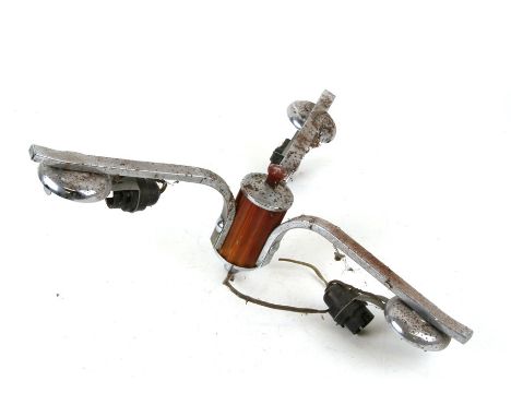 An Art Deco chrome and phenolic three-arm ceiling light.