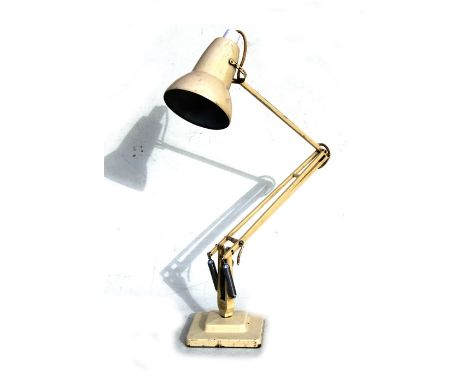 A Herbert Terry anglepoise lamp on square stepped base.