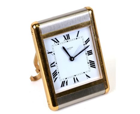 A Cartier brushed steel and brass travel alarm clock, 7.5cms (3ins) wide.Condition Reportsome light scratches to the case.see