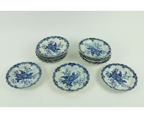 A set of 16 blue and white Dr. Wall period Worcester Plate Dishes, each decorated with flowers and fruit, with serpentine cir
