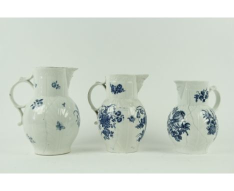 A set of three 18th Century blue and white Worcester leaf moulded Mask Jugs, of graduating form, decorated with floral sprays
