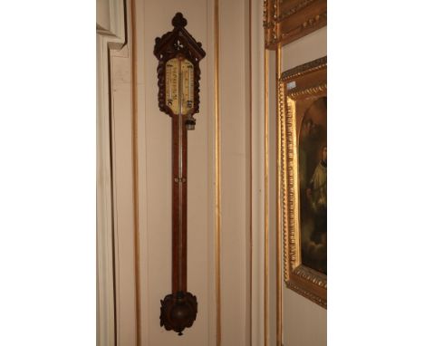 A quality Victorian oak framed Stick Barometer, with arched and pierced capital, by J. Hicks, 8, 9 &amp; 10 Hatton Gardens, L