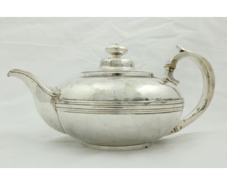 A George IV Irish silver Teapot, by William Nowlan, Dublin 1826, of circular form with scroll handle and urn finial, 639 grs.