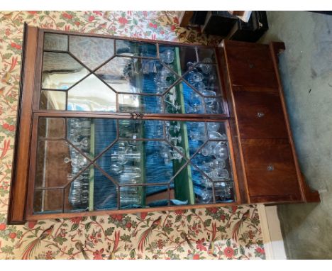 A mahogany Bookcase, on base, 19th Century and later, with two astragal glazed doors on a base with three cupboard doors rais
