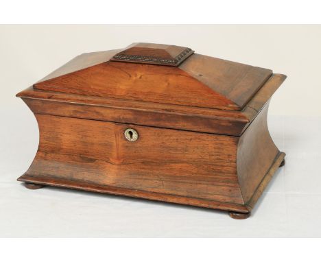 A William IV rosewood Tea Caddy, of casket form with rectangular domed top with spring loaded secret compartment above a conc