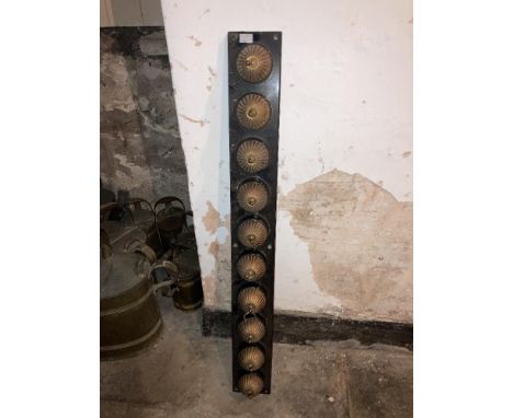 A rare set of 10 early electric brass Light Switches, each of circular reeded form on oblong ceramic panel. (10) 