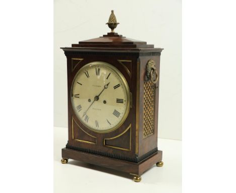 A fine Regency period rosewood cased and brass mounted Bracket Clock, by "Upjohn of Exeter," the circular convex painted dial