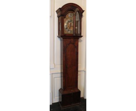 A good quality 18th Century walnut Longcase Clock, with arched blind fret work hood over a brass and silver dial, the circula