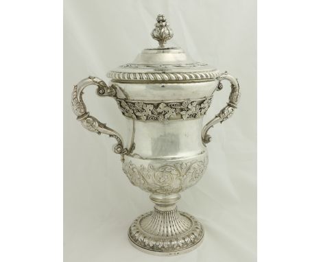 A large heavy Irish silver two handled Cup and Cover, George III Dublin 1815, by Jas. Scott, the dome top with a gadroon edge