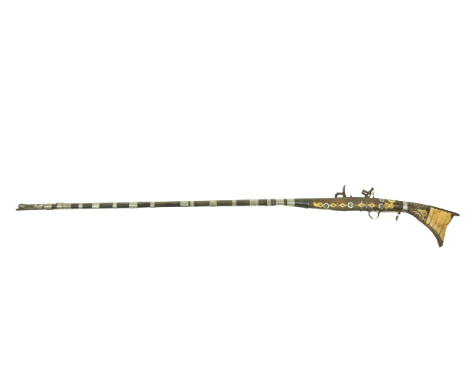 A good late 18th Century silver mounted North African Kabyle, snaphaunce Musket, with three-quarter walnut stock, half octago