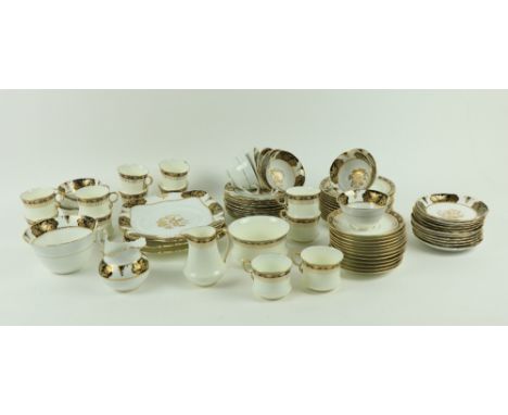 A Tuscan porcelain Tea Service, comprising 11 cups, 11 saucers &amp; 11 side plates, a sugar and cream, a pair of cake and sa