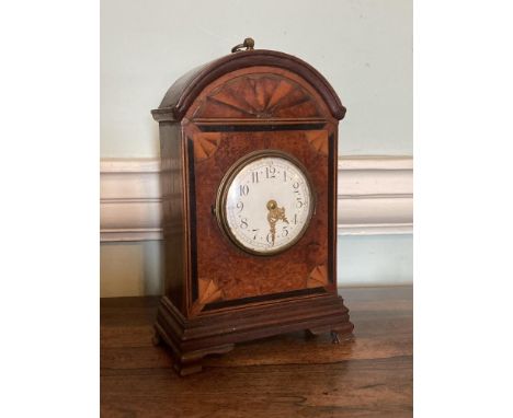 An attractive 19th Century walnut and inlaid Mantel Clock, the arched top with sunburst design over a circular enamel dial, o