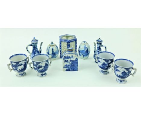 A set of four two handled blue and white Chinese porcelain Cups, each on stemmed base, 10cms (4") high; a blue and white Chin