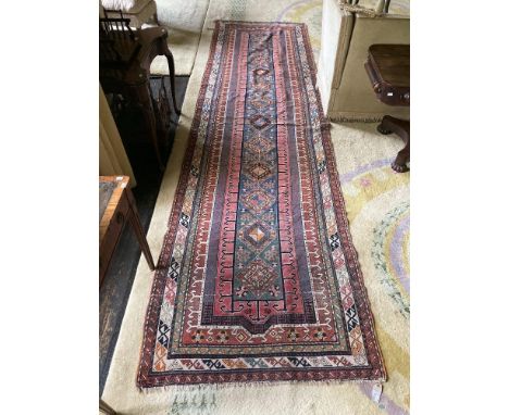A very fine semi-antique Persian Runner, the central medallion with a row of twelve hexagons, on a light blue ground with sty