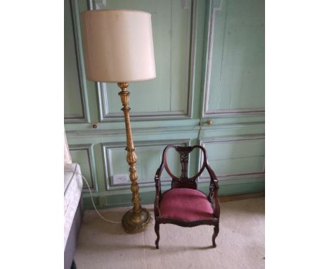 A gilt leaf moulded Lamp Standard;ÿtogether with an inlaid and carved Edwardian Armchair of low proportions. (2) 