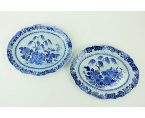 A good pair of Kangxi blue and white Chinese oval Platters, with willow trees, 15 1/2" (40cms). (2) 