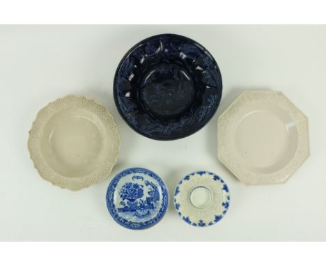 An 18th Century English salt glaze octagonal Bowl, with moulded scrolling foliage, 9" (23cms), a similar circular ditto of se