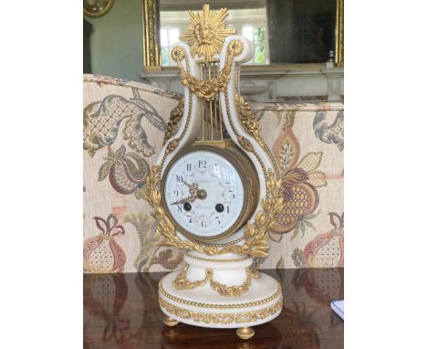A fine 19th Century French white marble and ormolu lyre Mantle Clock, the French movement with an outside count wheel strikin