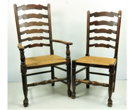 A set of 8 (6 + 2) elm Provincial ladder back Kitchen Chairs, each with straw seat on turned front legs and pad feet. (8) 