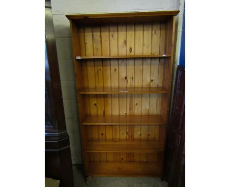 STAINED PINE FRAMED FOUR FIXED SHELF BOOKCASE WITH PANELLED BACK   