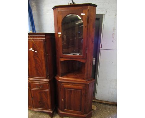 STAINED PINE FLOOR STANDING CORNER CUPBOARD WITH GLAZED DOOR, OPEN SHELF AND PANELLED CUPBOARD  