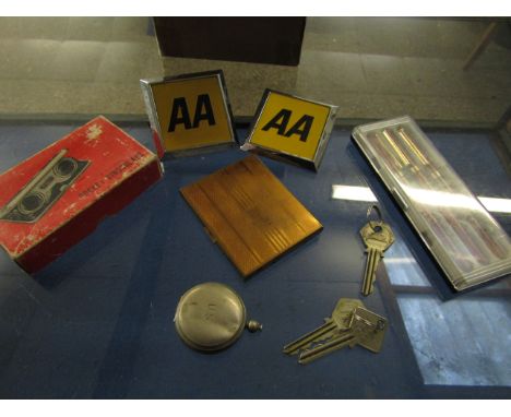 TWO 70S AA BADGES, BOXED PEN SET, BASE METAL STAMP CASE AND A NICKEL COMPASS   