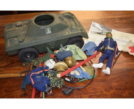 1970's Action man armored tank and trailer firing gun together with a figurine and accessories to include clothing, skis, gun