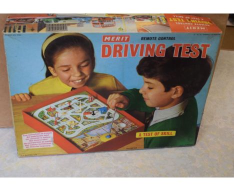 Merit driving test game, boxed, with Brimtoy train set, Tri-ang Busy Baby toy and other toys (boxed)   