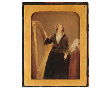19TH CENTURY ENGLISH SCHOOL Portrait of Mrs Fitzgerald, standing with harp alongside and music score, hand-tinted photograph,