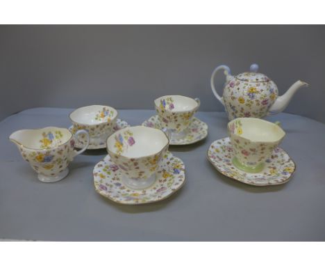 Foley china teawares; a teapot, cream and sugar, and four cups and saucers 