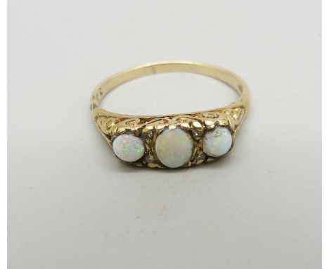 A 9ct gold, three stone opal and diamond ring, 2.6g, R 