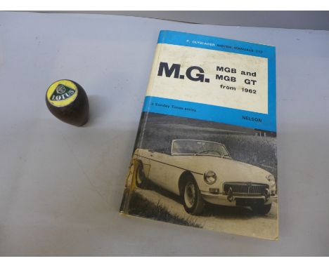 A Lotus Cortina Mk1 gear knob (wooden) and an M.G. 1962 motor manual 