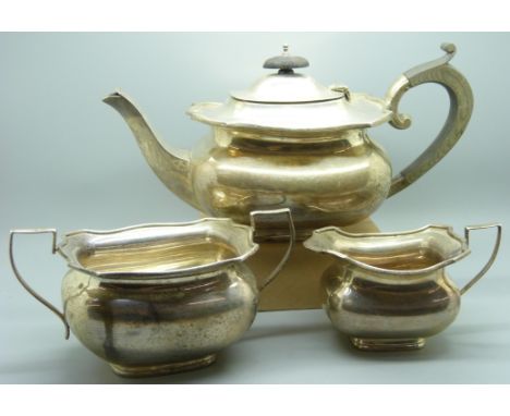 A three piece silver tea service, 1140g 